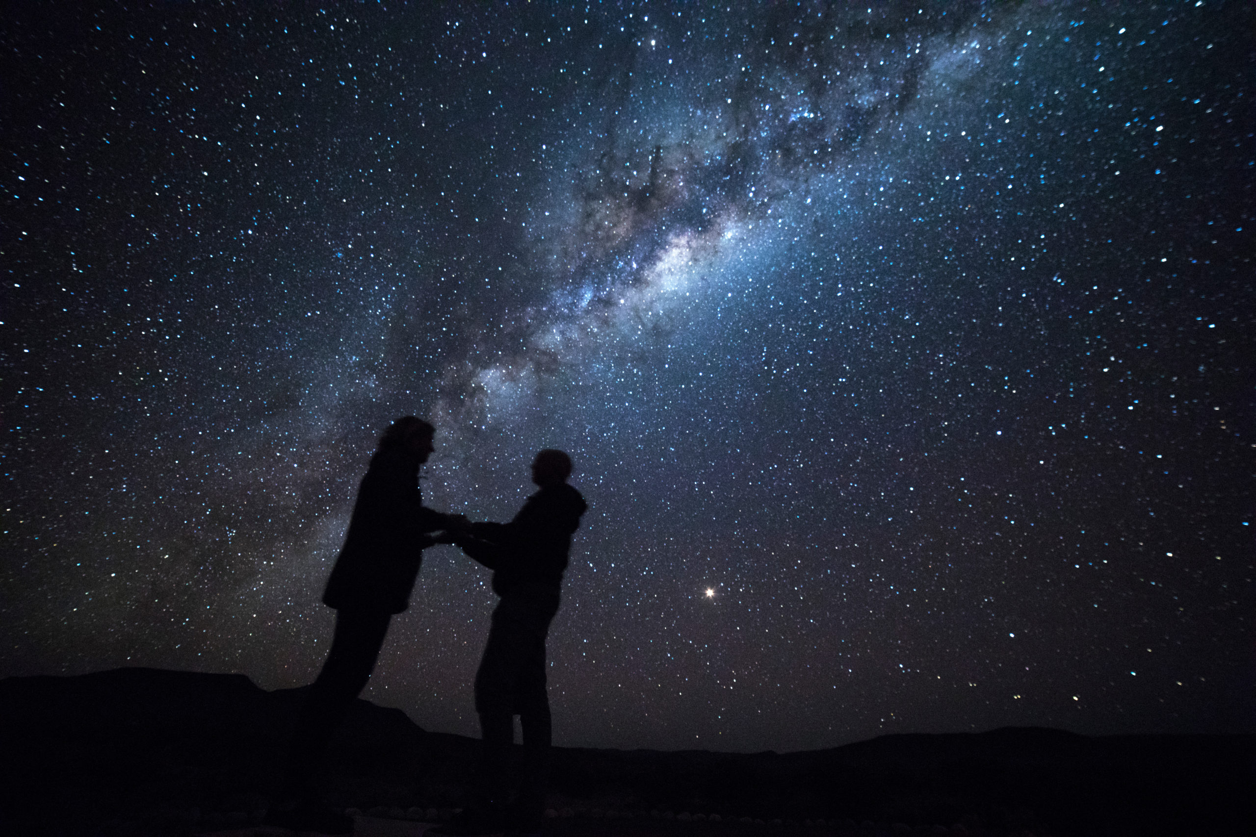 Couple in love under milky way Couple proposing under Milky Way