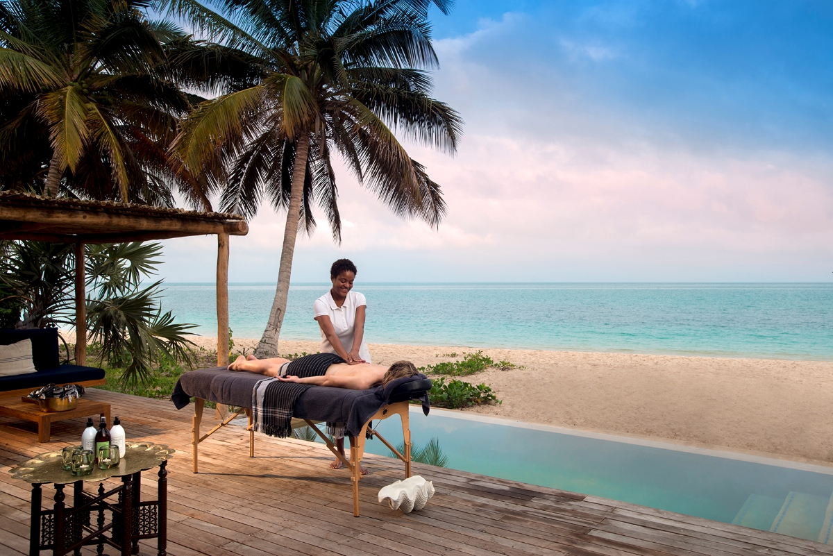 &Beyond-Benguerra-Island-beach-massage-2 Massage on private deck overlooking the ocean