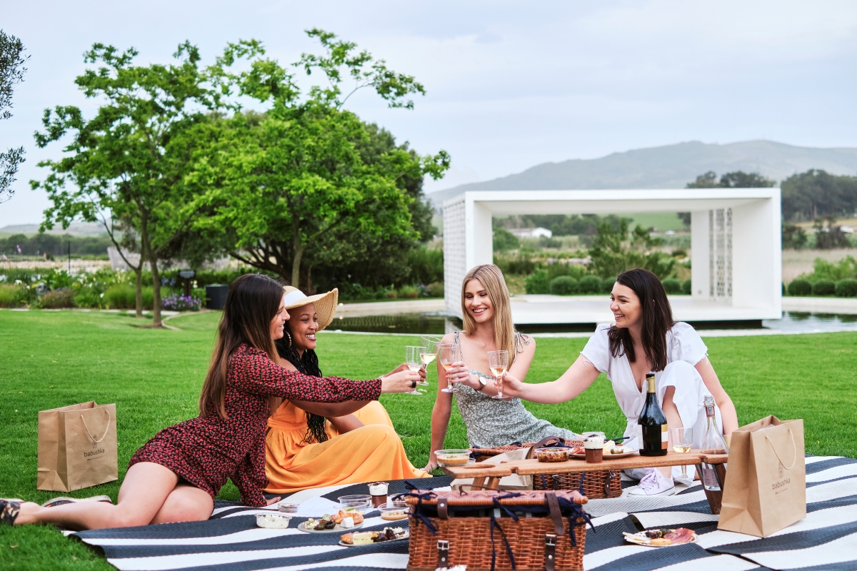 Hazendal-picnic-winelands Four women enjoying a summer picnic