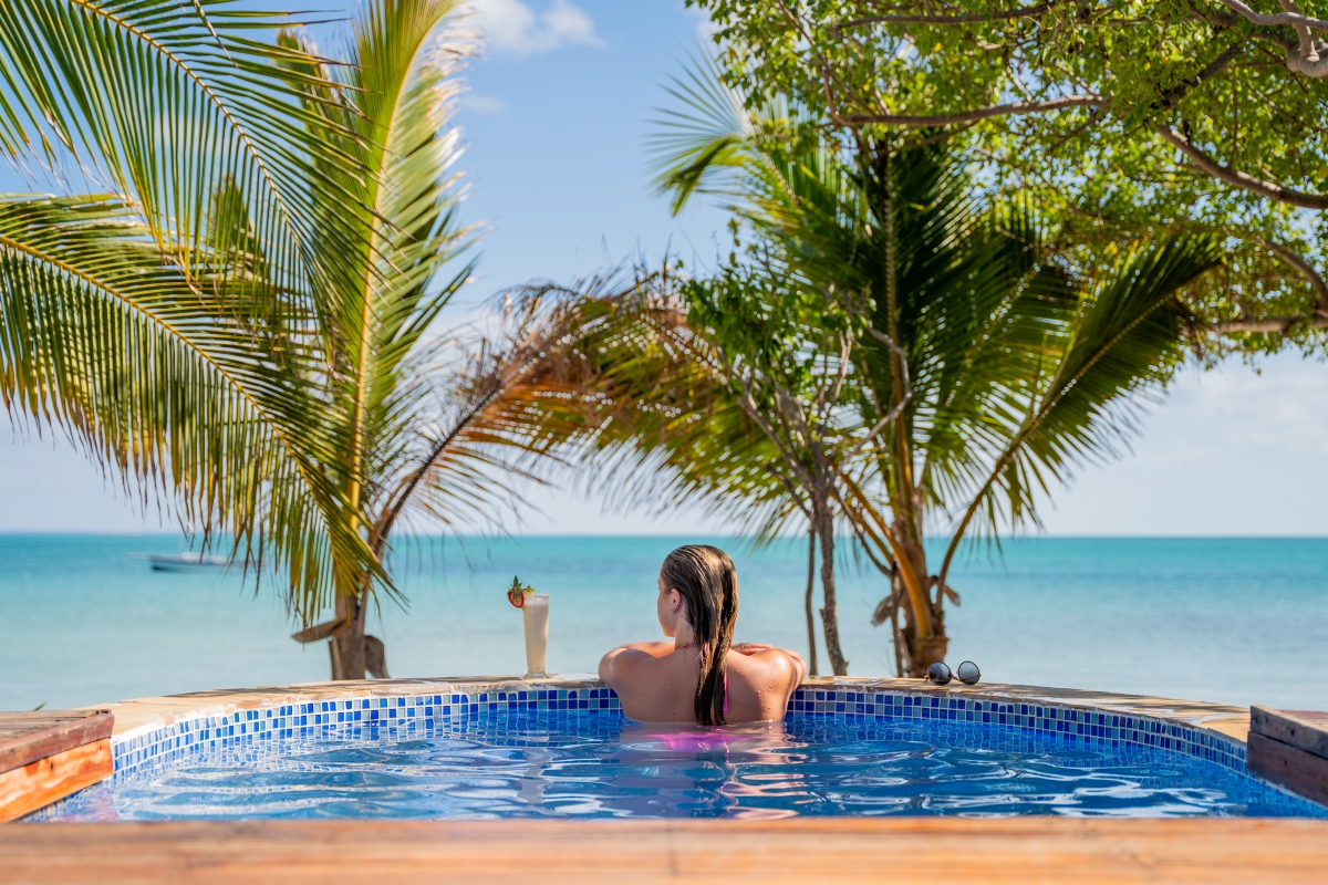 Azura-Benguerra-Island-beach-villa-pool Woman relaxing in her ocean-front plunge pool